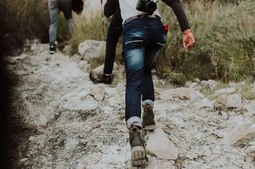 hiking-on-rugged-terrain-wearing-jeans